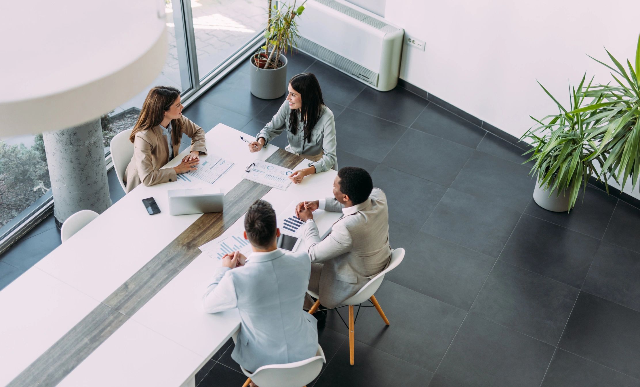 Small business team meeting with an IT consultant in an office
